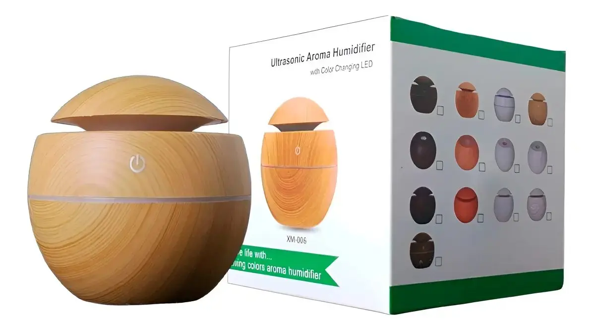 El humidificador junto a su caja, donde se lee Ultrasonic Aroma Humidifier with Color Changing LED